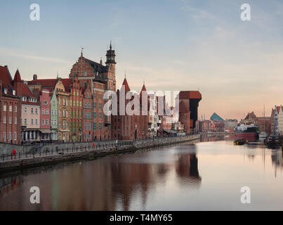 Old town of Gdansk in the early morning: an embankment and famous crane Zurav. High resolution panorama. Stock Photo