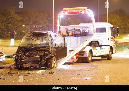 A truck recovering a vehicle of a road traffic collision outside the Miller and Carter restaurant in Garforth,Leeds. Stock Photo