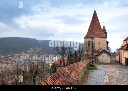 Cobblers' tower, one of the symbols of Sighisoara, on an overcast day. The tower bears the influence of baroque architecture, featuring a hexagonal ba Stock Photo