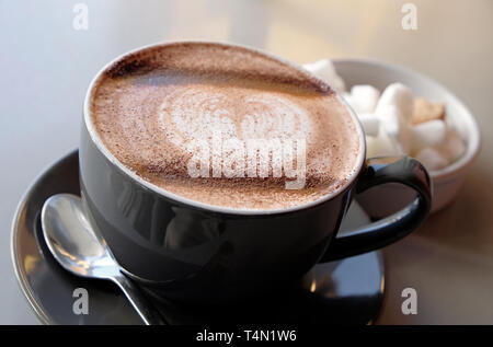 hot chocolate in cup and saucer, norfolk, england Stock Photo