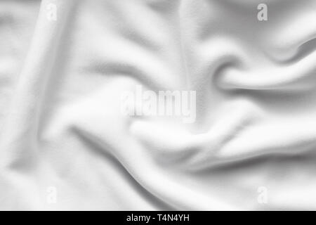 Texture of white fleece, soft napped insulating fabric made of polyester, wavy pattern, top view Stock Photo