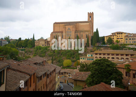 View of the Basilica of Cateriniana Di San Domenico on a cloudy September day. Siena, Italy Stock Photo