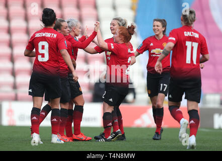 Manchester United's Alex Greenwood celebrates with her team mates after scoring from the penalty spot to make it 2-0 during the FA Women's Championship match at Leigh Sports Village. Stock Photo