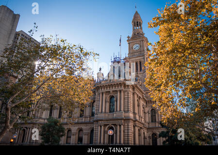 Sydney, New South Wales / Australia - May 13 2016: the Town Hall on a sunny day with trees in the foreground Stock Photo