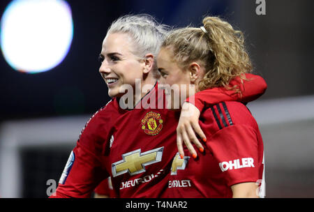 Manchester United's Charlie Devlin celebrates with team mate Alex Greenwood after she scores to make it 5-0 during the FA Women's Championship match at Leigh Sports Village. Stock Photo