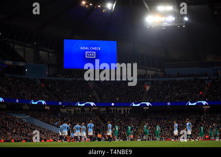 The big screen displays that a VAR goal check is being conducted during the UEFA Champions League quarter final second leg match at the Etihad Stadium, Manchester. Stock Photo