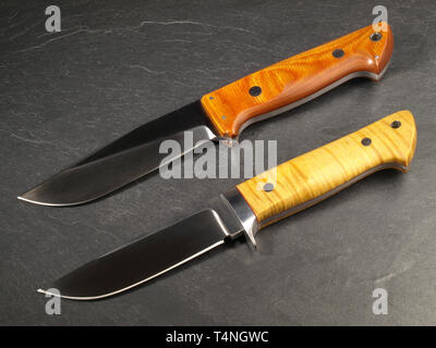 Unique Hunting Knives on Slate Background Stock Photo