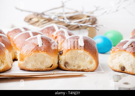 Freshly baked homemade hot cross buns on Easter table Stock Photo
