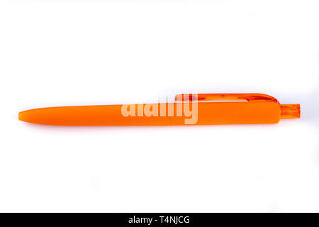 orange ballpoint pen on white Stock Photo