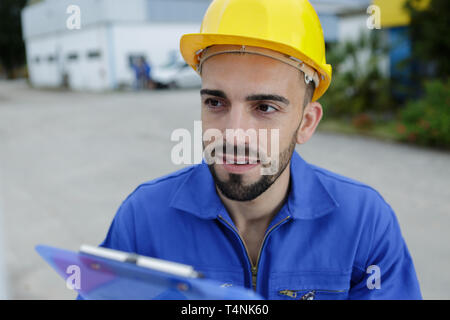 entrepreneur on construction site using electronic tablet Stock Photo