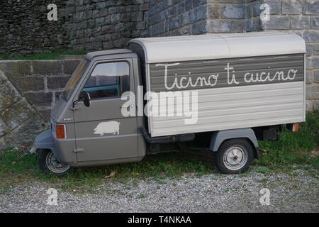 Old tiny funny car for delivering food in Ticino, Switzerland Stock Photo