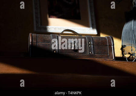 An old chest on a shelf in an ancient house Stock Photo