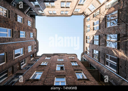 Warsaw, Poland. April 2019.   Upward view of the sky from a small courtyard among old buildings Stock Photo