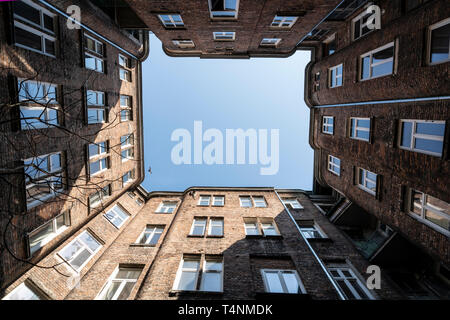 Warsaw, Poland. April 2019.   Upward view of the sky from a small courtyard among old buildings Stock Photo