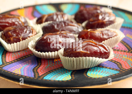 Close up of Delicious Medjool Dates on a Colorful Dish Stock Photo