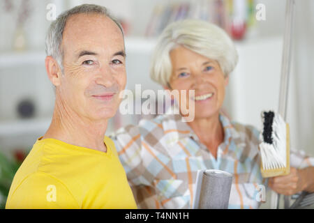 happy senior couple doing diy Stock Photo