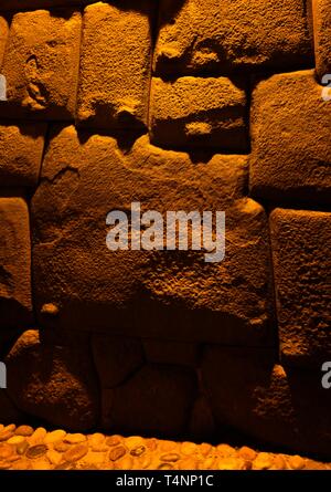 View to Twelve-angled stone aka Hatun Rumiyoc as a part of a wall of the palace of the Archbishop of Cuzco in Peru Stock Photo