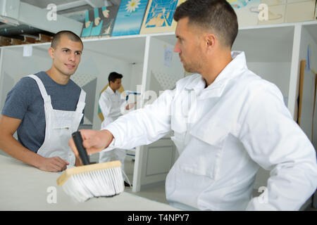 young apprentice painter in professional training Stock Photo