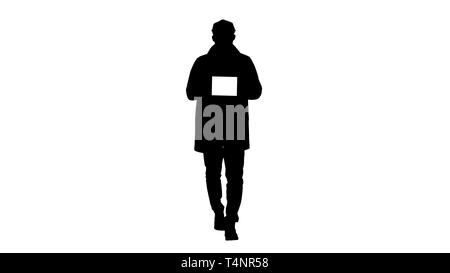 Full length shot. Silhouette Attractive man holding tablet with white key screen mockup. Professional shot in 4K resolution. 006. You can use it e.g.  Stock Photo