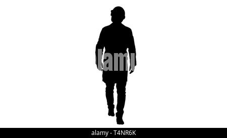 Full length portrait. Silhouette Engineer putting on protactive glasses while walking. Professional shot in 4K resolution. 004. You can use it e.g. in Stock Photo