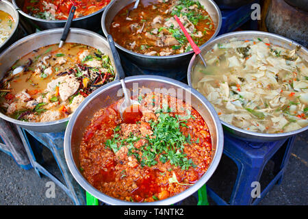 delicious fresh street food in Thailand - top view - Thai Curry, Tamarind, Tom Yam, Shrimp, Pork, Pad Thai Stock Photo