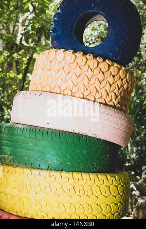 Colorfully painted tires stacked on each other Stock Photo