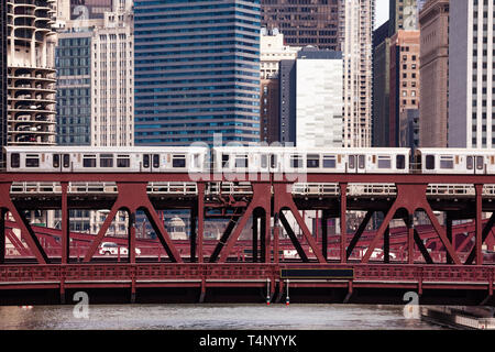 Trains running on the metal bridge over river in City of Chicago, Illinois, USA Stock Photo