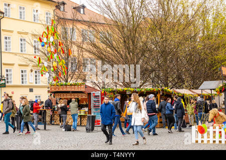 Prague, Czech Republic - 15.04.2019: View from Charles Bridge to people are celebrate easter at the fair on square in Prague, Czech republic Stock Photo