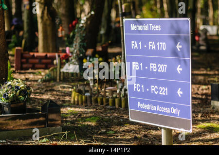 Sign to memorial trees in a cemetery