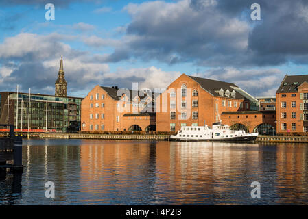 Old waterfront buildings along Copenhagen Harbour in the city centre, Christianshavn, Copenhagen, Denmark Stock Photo