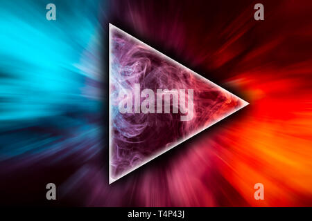 Close up swirling red and blue smoke in the shape of a triangle on black isolated background Stock Photo