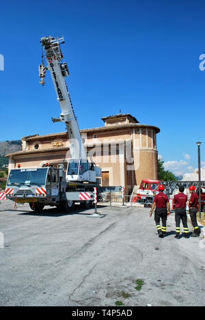 Firefighters plan to put in safety buildings damaged after the earthquake - L'aquila, Italy. © Antonio Ciufo Stock Photo