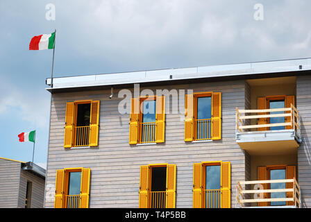A wooden house in one of the 'New Towns', the temporary “permanent homes” wanted by Berlusconi to offer a powerful image of post-earthquake efficiency Stock Photo