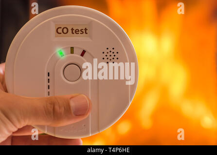 Carbon monoxide alarm in the air for rooms heated by stoves and fireplaces Stock Photo