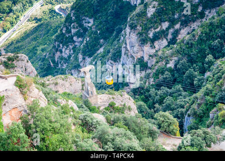 Yellow cable car in the Aeri de Montserrat rise to de Montserrat Abbey near Barcelona, Spain, Catalonia Stock Photo