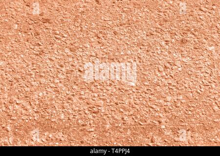 Old asphalt surface texture close up. Orange color toned background Stock Photo