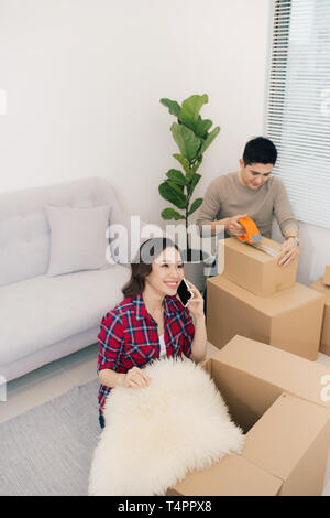 Young loving couple moving to a new house. Home and family concept. Stock Photo