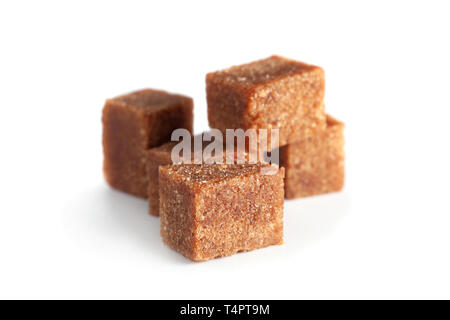 Brown sugar cubes closeup isolated on white background Stock Photo