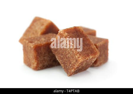 Brown sugar cubes closeup isolated on white background Stock Photo