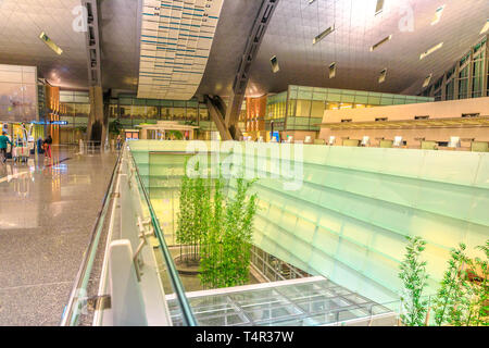 Doha, Qatar - February 24, 2019: interior garden of Hamad International Airport or Doha Hamad Airport, the only airport in Qatar open to civilian Stock Photo