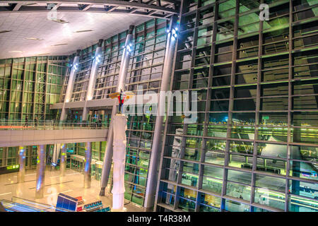 Doha, Qatar - February 24, 2019: interior windows of lobby of Hamad International Airport or Doha Hamad Airport, the only airport in Qatar open to Stock Photo