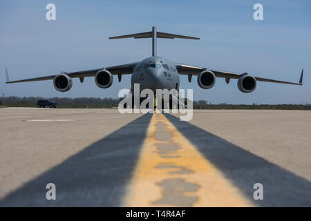 A C-17 Globemaster III, assigned to Wright-Patterson Air Force Base, Ohio, lands during exercise Patriot Hook 2019, April 11, 2019, at Vandenberg Air Force Base, Calif. The 5-day exercise provided realistic mission training for Air Force Reserve Command members and other United States Air Force aircrew. (U.S. Air Force photo by Airman 1st Class Aubree Milks) Stock Photo