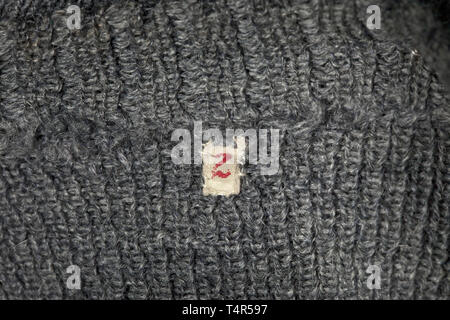 A pullover, officially 'Schlupfjacke 36' for army personnel Issue with V-neckline in grey wool, collar and cuffs with wide, woven-in green bands, sewn-in size tag '2'. Repaired areas. Moth traces. historic, historical, 20th century, Editorial-Use-Only Stock Photo