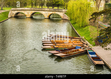 Punts moored on the bank of the river Cam, Cambridge, England on a bright spring day Stock Photo
