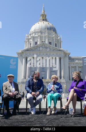 San Francisco, USA. 17th Apr, 2019. Photographer Luigi Toscano (2nd from left) sits together with the portrayed Holocaust survivors Eleanor Chroman (r), Ilse Alexander and Ben Stern at the opening of his exhibition in front of the city hall. Large-format pictures of Holocaust survivors taken by German-Italian photographer Luigi Toscano have been on display in a large square in front of San Francisco City Hall since Wednesday. (Zu dpa 'German photographer shows pictures of Holocaust survivors in the USA') Credit: Barbara Munker/dpa/Alamy Live News Stock Photo