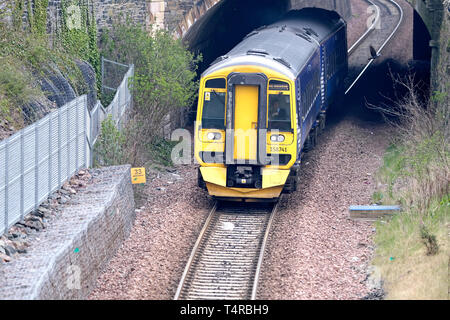 18.04.2019.  Ladhope Vale, GALASHIELS, UK. Trains on Borders Rail CAPTION: The 09:58 train departs Galashiels for Edinburgh Waverley, with two carriages, recent days have seen many cancellations on the route, but recent assurances promise improved service for customers. Seen here is a Class 158/0 (158741) British Rail Class 158 Express Sprinter is a diesel multiple-unit (DMU) train, built for British Rail between 1989 and 1992 by BREL at its Derby Works. (Photo: Rob Gray  ) Stock Photo