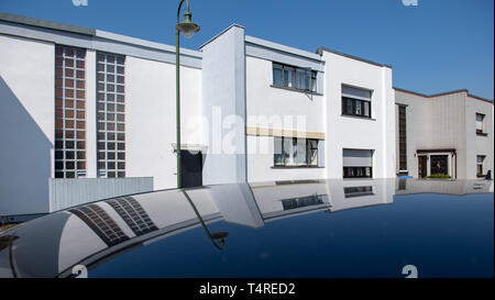 18 April 2019, Saxony-Anhalt, Dessau-Roßlau: View into the terraced house settlement Dessau-Törten designed by Walter Gropius. After extensive renovation work, the original Bauhaus buildings open before Easter. For the anniversary year 2019 they will receive a new coherent curatorial narrative. The buildings themselves become exhibition objects. Photo: Hendrik Schmidt/dpa-Zentralbild/dpa Stock Photo