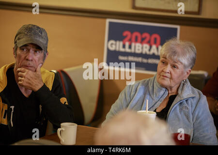 Creston, Iowa, USA. 18th Apr, 2019. New York Community members listen as Democratic Senator Kirsten Gillibrand campaigns for President of the United States during a ''listening tour'' stop at at the Adams Street Espresso & Soda Shoppe in Creston, Iowa. More than a dozen Democratic party candidates are campaigning in the state of Iowa to win the Iowa Democratic Caucuses February 3, 2020. Credit: ZUMA Press, Inc./Alamy Live News Stock Photo