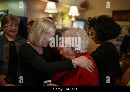 Creston, Iowa, USA. 18th Apr, 2019. New York Democratic Senator Kirsten Gillibrand campaigns for President of the United States as she cheer up with a supporter during a ''listening tour'' stop at at the Adams Street Espresso & Soda Shoppe in Creston, Iowa. More than a dozen Democratic party candidates are campaigning in the state of Iowa to win the Iowa Democratic Caucuses February 3, 2020. Credit: ZUMA Press, Inc./Alamy Live News Stock Photo