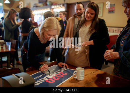 New York Democratic Senator Kirsten Gillibrand campaigns for President of the United States as she sign autograph for a supporter during a 'listening tour' stop at at the Adams Street Espresso & Soda Shoppe in Creston, Iowa.  More than a dozen Democratic party candidates are campaigning in the state of Iowa to win the Iowa Democratic Caucuses February 3, 2020. The Iowa Caucuses is part of a series of primary elections in the United States that will help the Democratic party decide the candidate that will be the opponent of United States President, and defacto leader of the Republican party, Do Stock Photo